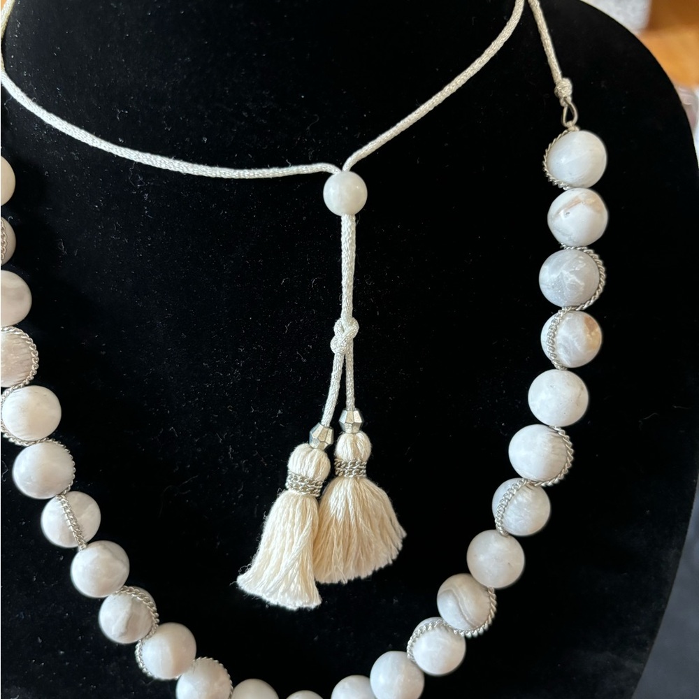 White stone beads with silver accent chain on beautiful white rope with tassel